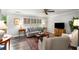 Comfortable living room featuring modern furnishings, a large window, and hardwood floors at 2349 Northlake Ne Ct, Atlanta, GA 30345