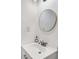 Bright bathroom features a toilet, sink and gold framed mirror at 5490 Chemin De Vie, Sandy Springs, GA 30342