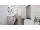 Bright bathroom with double sinks, modern fixtures, and a freestanding tub at 5490 Chemin De Vie, Sandy Springs, GA 30342