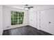 Bright bedroom with hardwood floors, large window, and closet space at 5490 Chemin De Vie, Sandy Springs, GA 30342