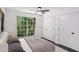 Cozy bedroom with a large window and spacious closets at 5490 Chemin De Vie, Sandy Springs, GA 30342