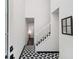 Entryway with patterned tile, view of the stairs, and natural light at 5490 Chemin De Vie, Sandy Springs, GA 30342