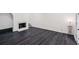 Neutral living room features a fireplace, and dark floors at 5490 Chemin De Vie, Sandy Springs, GA 30342