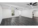Open living room with gray vinyl flooring, recessed lighting, and ample natural light at 5490 Chemin De Vie, Sandy Springs, GA 30342