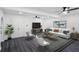 Living room features dark floors, modern decor, and lots of natural light at 5490 Chemin De Vie, Sandy Springs, GA 30342