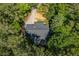 An aerial view of a home with a gray roof surrounded by lush, green trees at 6026 Belle Meade Ct, Villa Rica, GA 30180