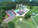 A community aerial view showcasing amenities including a golf course, tennis courts, and a pool at 6026 Belle Meade Ct, Villa Rica, GA 30180