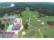 Aerial view of the golf course, pool, and tennis courts at 6026 Belle Meade Ct, Villa Rica, GA 30180