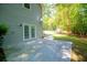 Backyard patio with a view of the lush lawn and surrounding trees at 6026 Belle Meade Ct, Villa Rica, GA 30180