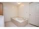 Bathroom featuring bathtub and tiled floors at 6026 Belle Meade Ct, Villa Rica, GA 30180