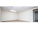 Carpeted bedroom with white walls, lighted ceiling, with natural light and an entrance to another room at 6026 Belle Meade Ct, Villa Rica, GA 30180