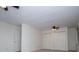 Bedroom with carpet floors, ceiling fans, and closet for ample storage at 6026 Belle Meade Ct, Villa Rica, GA 30180