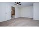 Bedroom with a plush carpet, ceiling fan, and an ensuite bathroom at 6026 Belle Meade Ct, Villa Rica, GA 30180