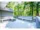 Spacious deck with built-in benches and wooded surroundings at 6026 Belle Meade Ct, Villa Rica, GA 30180