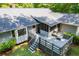 Back deck with screened-in porch, surrounded by mature trees, offering privacy at 6026 Belle Meade Ct, Villa Rica, GA 30180