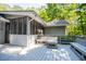 Deck with screened-in porch and view to back yard and wooded surroundings at 6026 Belle Meade Ct, Villa Rica, GA 30180