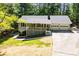 Charming single-story home featuring a covered porch and a two-car garage at 6026 Belle Meade Ct, Villa Rica, GA 30180