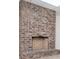 Spacious room showcasing a rustic brick fireplace with raised brick platform for seating at 6026 Belle Meade Ct, Villa Rica, GA 30180