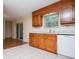 Functional kitchen with wood cabinets and bright tile floors at 6026 Belle Meade Ct, Villa Rica, GA 30180
