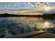 A stunning lake view at sunset, captured from the stern of a boat, highlighting the calm water at 6026 Belle Meade Ct, Villa Rica, GA 30180