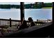 Scenic view of the lake from a covered porch, perfect for enjoying the outdoors at 6026 Belle Meade Ct, Villa Rica, GA 30180