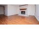 Cozy living room features a fireplace and hardwood floors at 6026 Belle Meade Ct, Villa Rica, GA 30180