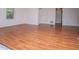 Open living area featuring beautiful hardwood floors and natural light at 6026 Belle Meade Ct, Villa Rica, GA 30180