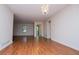 Bright living room with hardwood floors and stylish lighting fixture at 6026 Belle Meade Ct, Villa Rica, GA 30180