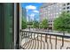Balcony view showcasing the city skyline and lush greenery at 1421 Peachtree Ne St # 212, Atlanta, GA 30309