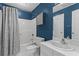 A full bathroom features a tub with shower, toilet, and modern vanity with countertop sink at 1421 Peachtree Ne St # 212, Atlanta, GA 30309