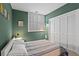 The bedroom is painted a soothing green and includes a large window with views and double closet at 1421 Peachtree Ne St # 212, Atlanta, GA 30309