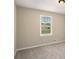 Bedroom featuring neutral walls, plush carpet, and a window that provides natural light at 2895 Fairview Rd, Covington, GA 30016