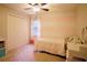 Cozy bedroom featuring a comfortable bed, a closet, and a window with natural light at 4130 Providnce Square, Alpharetta, GA 30009