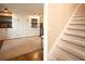 Versatile bonus room featuring built-in cabinets and drawers, with an adjacent staircase leading to upper level at 4130 Providnce Square, Alpharetta, GA 30009