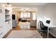 Inviting living room boasts hardwood floors and an open layout leading to a cozy seating area with a large window at 4130 Providnce Square, Alpharetta, GA 30009