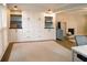 Bright room with fireplace, built-ins, and hardwood floors, providing a cozy atmosphere at 4130 Providnce Square, Alpharetta, GA 30009