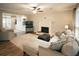 Spacious living room features a cozy fireplace, hardwood floors, and an open layout, perfect for entertaining at 4130 Providnce Square, Alpharetta, GA 30009