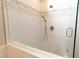 Sleek walk-in shower featuring white subway tile and glass door, offering a clean and contemporary design at 4130 Providnce Square, Alpharetta, GA 30009