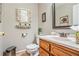 Bathroom with framed mirrors and patterned wooden vanity at 12510 Georgia 36, Covington, GA 30014