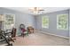 Spacious bedroom with large windows that fill the room with natural light, creating a serene and inviting space at 12510 Georgia 36, Covington, GA 30014