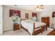 Cozy main bedroom with natural lighting, ceiling fan, and a full-size bed at 12510 Georgia 36, Covington, GA 30014