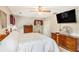 Comfortable bedroom featuring a ceiling fan, window, tv and ample natural light at 12510 Georgia 36, Covington, GA 30014