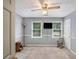Spare bedroom with neutral walls, ceiling fan, and television set at 12510 Georgia 36, Covington, GA 30014
