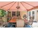 Inviting outdoor deck featuring an outdoor dining table beneath a covered patio at 12510 Georgia 36, Covington, GA 30014
