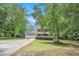 Charming two-story home featuring a covered front porch, attached garage, and well-manicured landscaping at 12510 Georgia 36, Covington, GA 30014