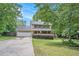 Charming two-story home featuring a covered front porch, attached garage, and well-manicured landscaping at 12510 Georgia 36, Covington, GA 30014
