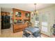 Eat-in kitchen with wooden cabinets, a gas cooktop, and door leading to the outside at 12510 Georgia 36, Covington, GA 30014