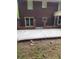 Spacious backyard with a metal fence, patio, and mature trees at 6210 Douglas Manor Ct, Douglasville, GA 30134