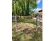 Fenced backyard with lush green grass, mature trees, and space for activities, offering a private outdoor retreat at 6210 Douglas Manor Ct, Douglasville, GA 30134