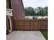 Backyard featuring a wooden fence, a patio, and a gate at 6210 Douglas Manor Ct, Douglasville, GA 30134